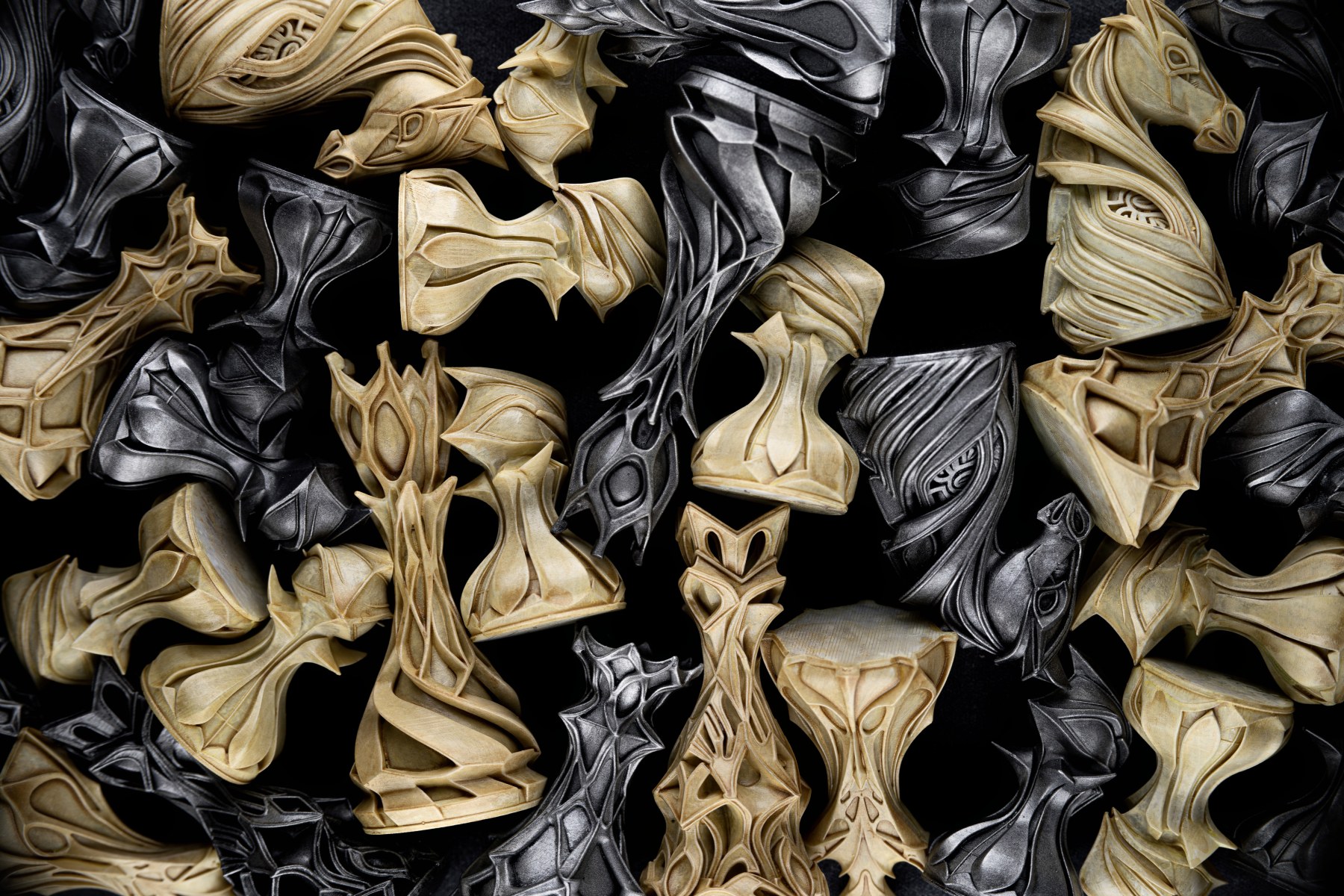 Hand-finished chess pieces in ivory and silver